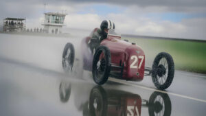 Dies ist ein KI-generiertes Bild mit Hilfe von Gemini. Ein Cyclekart jagt bei Regen die Piste entlang.