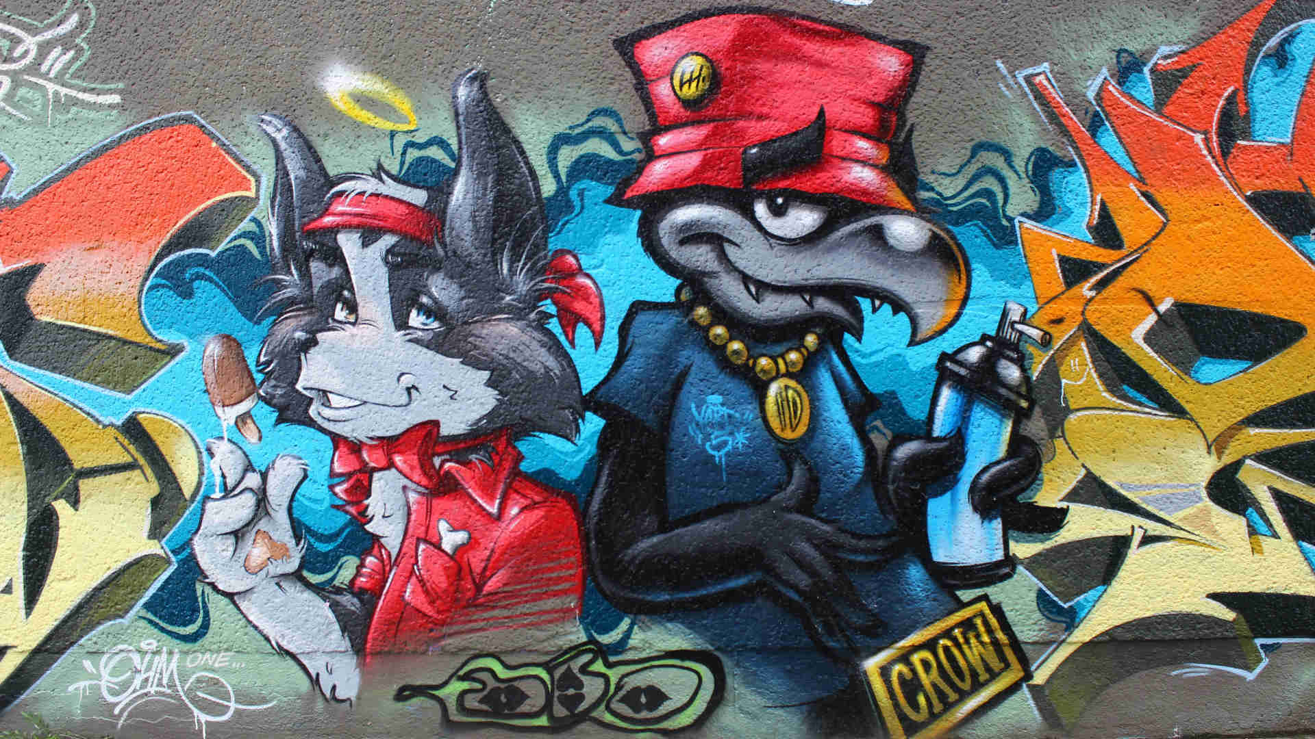 Graffiti – Eine Wand mit Graffiti. Die Motive sind Comic-Fantasie, Tiere in menschlicher Gestalt.